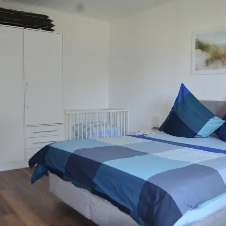 Bright, spacious comfort apartment with private garden and walk-in shower.