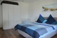 Bright, spacious comfort apartment with private garden and walk-in shower.