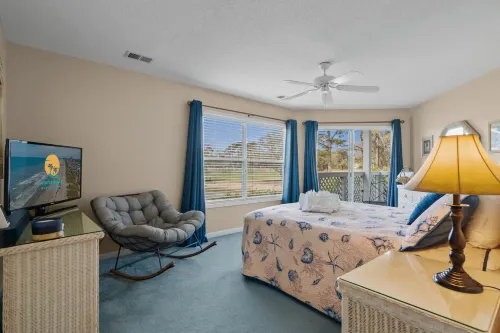 Balconies Overlooking Water and Golf Course - Cozy Beach Haven