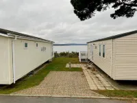 Lotus 2 bedroom dog friendly caravan with veranda offers a stunning sea view.