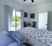 Room w/ ocean view balcony next to the beach. 2 pools, fire pit, gardens & more!