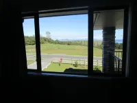 Apartment with lake, mountain & rural views.