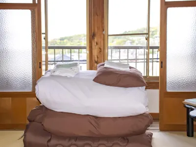Guest Cafe Kuchikumano فنادق في كاميتوندا