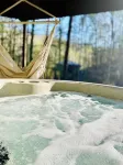 Unique octagon treehouse chalet, panoramic forest views, community pool.