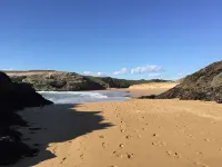 House on the wild coast of beautiful island at sea