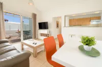 B1, in a small complex with communal heated pool 100m from the sea