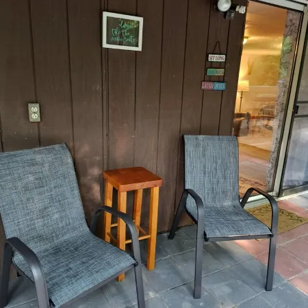 Beautiful cabin situated on wooded land with nice yard clearing and small stream
