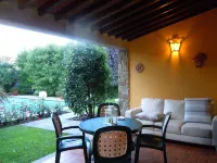 House with large veranda, garden and swimming pool