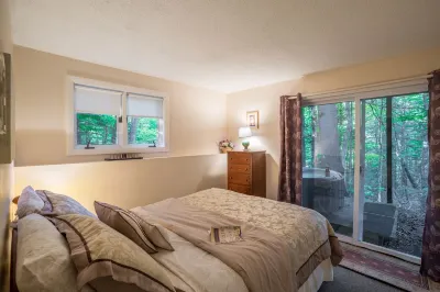 Resort home with Private hot tub , fireplace, pools, pond, WIFI