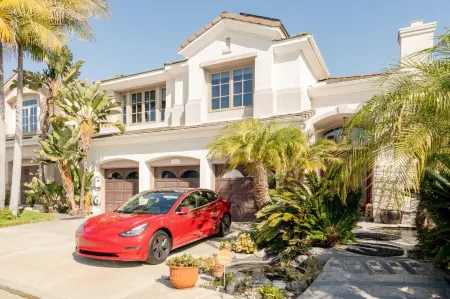 Luxe family home w/ 116 inch theatre, near beach w/ private yard & EV chargers