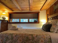 Lakefront luxury, Lake George log cabin home with your own private sandy beach