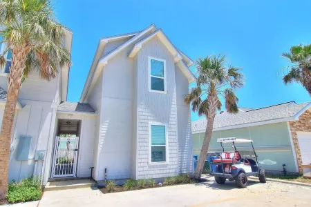 In-town coastal getaway, with a heated pool & level 2 Tesla EV charger on site.