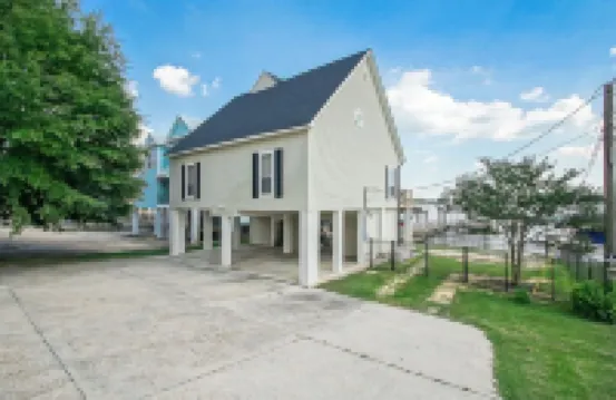 It's About River Time, a 3BR/3BA house on False River, fenced yard & large pier!