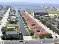 REMODELED - 2 Bedrm 2 Bath Bayside Townhome on Canal with Pool across from Mall