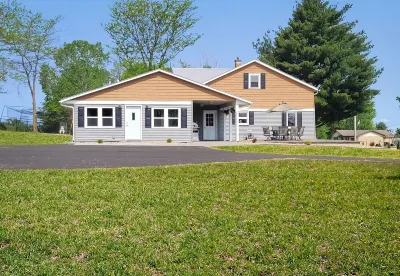 Bring the Whole Family to This Great Home with an Acre of Room for Fun.