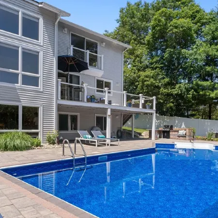 Modern coastal retreat w/ pool, close to beaches and golf courses.