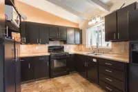 Monterey craftsman style home with vaulted exposed-beams ceiling hardwood floor