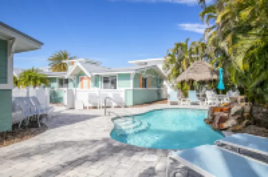 Tropical Flair and Pool Oasis - Charming Beach Getaway