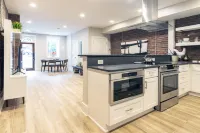 Spacious Open Kitchen and Exposed Brick - Stunning Urban Retreat