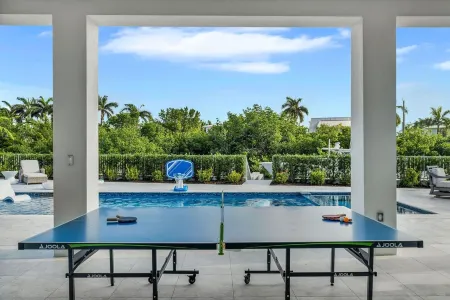 Sophisticated 5-bedroom, elevator, 50' dock, heated pool/spa, sleep 12