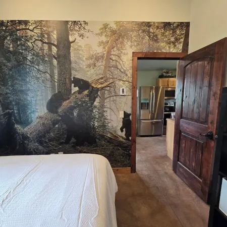 Themed Bear's Den Cabin__nestled in the pines minutes outside of Glacier Park.