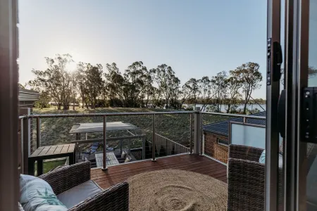 Relax & watch magical sunsets upstairs balconies overlooking the beautiful lake