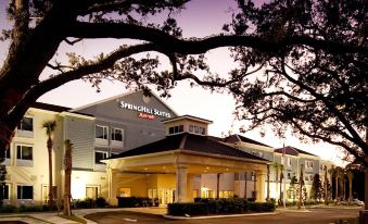 "a large building with a tree in front of it , the words "" springhill suites "" are visible" at SpringHill Suites Vero Beach
