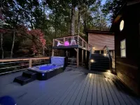 Luxury Tiny House with Treehouse Bedroom and HotTub on 34acres secluded