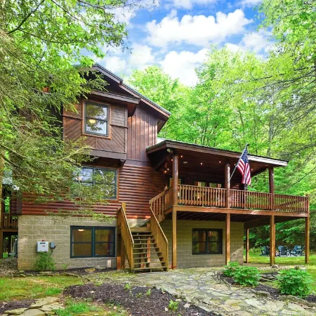 Logged & Loaded Cabin! 9Min to WISP! Hot tub, fire pit! Pets! EV charger!