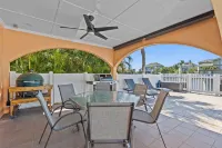 Water Front Home with Heated Pool & Hot Tub, 2 Master Suites & a Floating Dock.