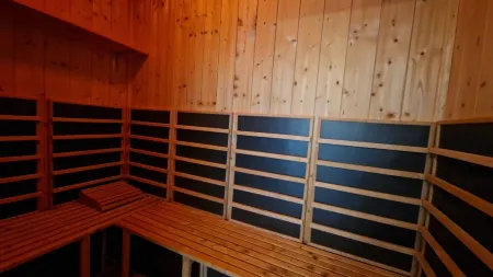 Close to the beach holiday home in a quiet field location with a spacious wooden terrace