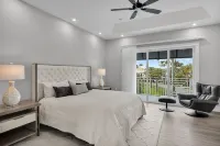 Sophisticated 5-bedroom, elevator, 50' dock, heated pool/spa, sleep 12