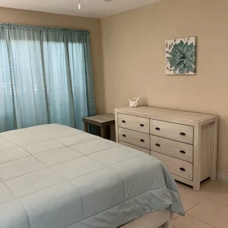 The Harvey Nicole: Modern Caribbean Ocean Front Condo Grand Cayman.