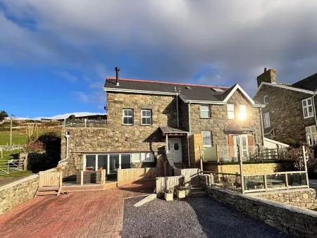 A luxury modern home, surrounded by a picturesque ocean and welsh countryside.