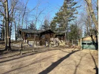 Lucky View Lodge Log Cabin on Big Butternut Lake Luck, WI 3 acre 300ft lakeshore Hotels in Luck