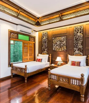 ห้องดีลักซ์เตียงแฝดพร้อมวิวสวนหย่อม