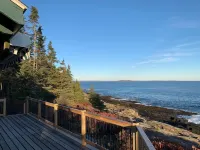 Sunrise Cottage. Relaxing waterfront deck on the rocky shore of Bailey Island.