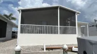 Quiet, clean & comfy 2 bed-2bath with 8000lb boat lift and large screened lanai Hotels near Fort Myers / Pine Island KOA Holiday