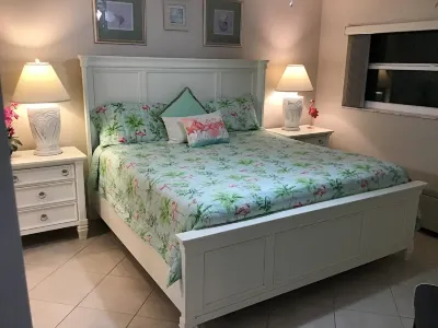 Tropical Decor Condo, Golf, Tennis and minutes to our private beach.