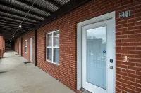 Spacious Living Area with Rooftop Bar Access - Stylish Tranquil Hotels in Clarksville