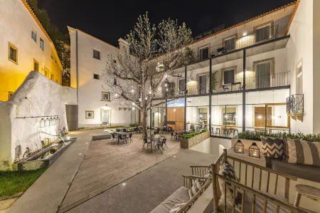 Sapientia Boutique Hotel Отели рядом с достопримечательностью «Baroque Library - University of Coimbra»