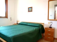 Casa vacanze Tanoshii al piano terra con spazio all'aperto e posto auto