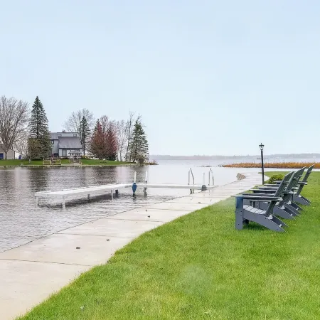 Cadillac Vacation Rental w/ Dock on Lake Mitchell!