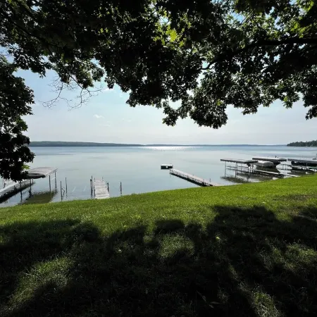 Charming 2-bedroom cabin sits on 2.5 acres on Hubbard Lake.