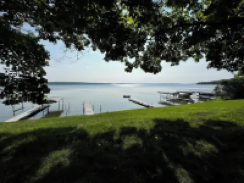 Charming 2-bedroom cabin sits on 2.5 acres on Hubbard Lake.