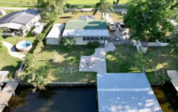 3 BR 2 BA House w/Dock on Deep Canal in Bass Capital