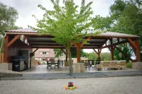 The farmhouse with the red shutters