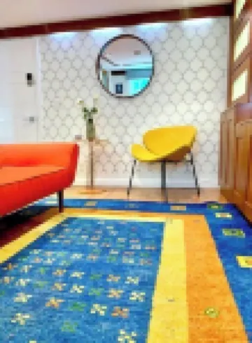 Live in this iconic East Side lower level apartment