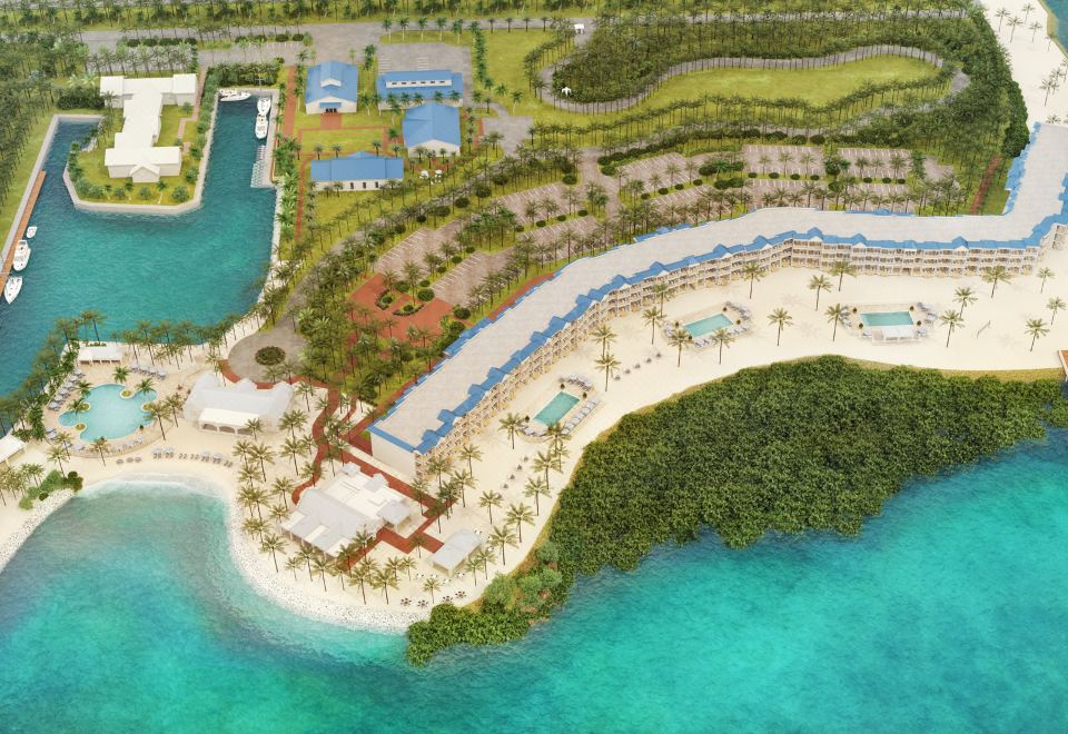 a bird 's eye view of a beachfront resort with multiple buildings , pools , and water at Isla Bella Beach Resort & Spa - Florida Keys