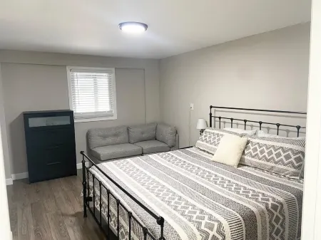 A clean luxury suite on a lakeside view with city amenities within 5 minutes.